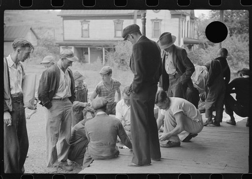 Untitled photo, possibly related to: Coal miners card gambling Saturday afternoon on porch of company store, Chaplin, West Virginia