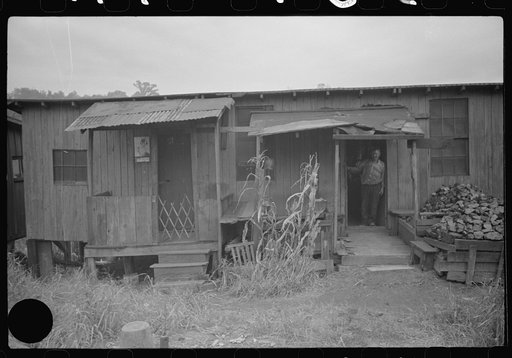 Untitled photo, possibly related to: Section of Rosedale Mining Compnay. Shanties by the river. Scotts Run, West Virginia