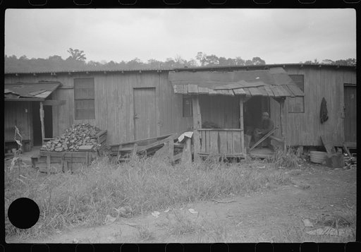 Untitled photo, possibly related to: Section of Rosedale Mining Compnay. Shanties by the river. Scotts Run, West Virginia