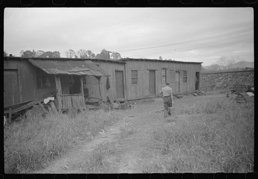 Carrying water, coal miners shacks. Scotts Run, West Virginia