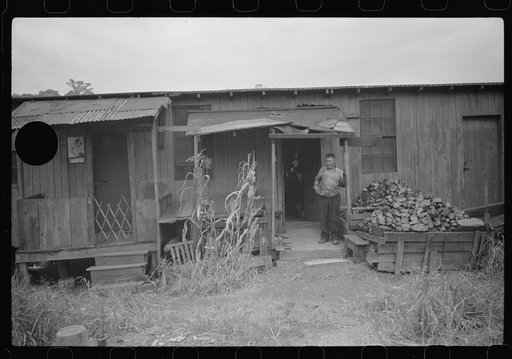 Untitled photo, possibly related to: Section of Rosedale Mining Compnay. Shanties by the river. Scotts Run, West Virginia