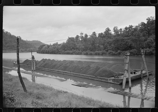 Coal barge on river, Scotts Run, West Virginia