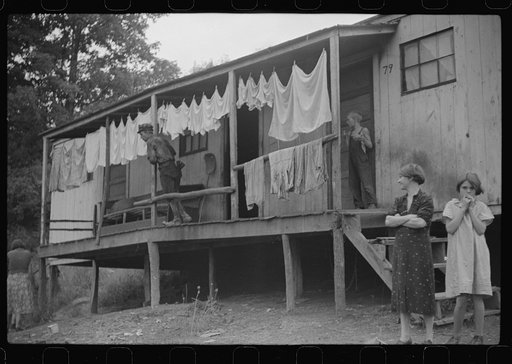 Coal miner's shack and some of his family, Pursglove, West Virginia