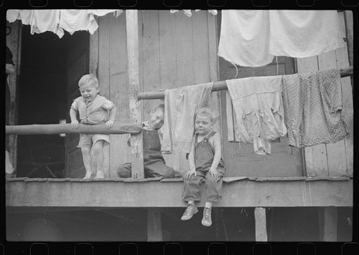 Untitled photo, possibly related to: Coal miner's shack and some of his family, Pursglove, West Virginia