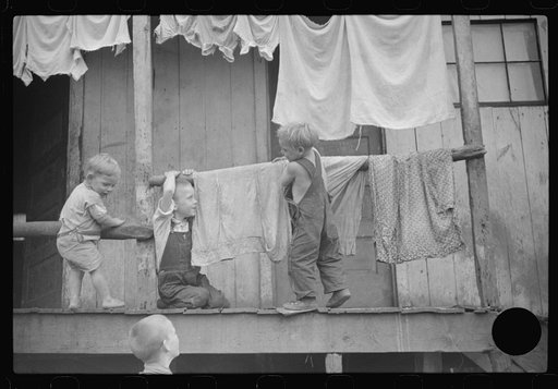 Untitled photo, possibly related to: Coal miner's shack and some of his family, Pursglove, West Virginia