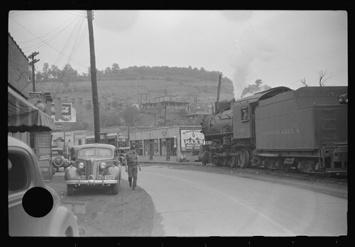 Untitled photo, possibly related to: Train pulling coal through center of town morning and evenings, Osage, West Virginia