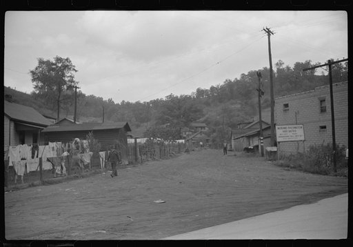 Untitled photo, possibly related to: Clothes line on fence in front yard of coal miner's home, Scotts Run, West Virginia