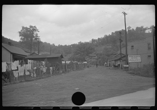 Untitled photo, possibly related to: Clothes line on fence in front yard of coal miner's home, Scotts Run, West Virginia