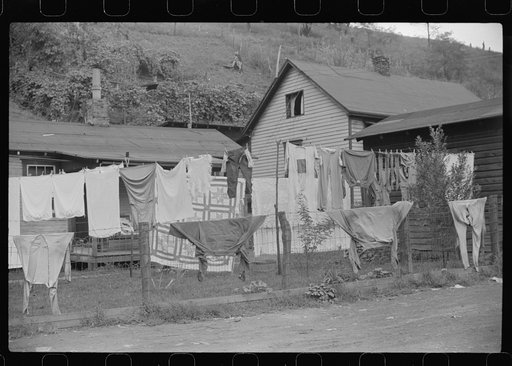 Clothes line on fence in front yard of coal miner's home, Scotts Run, West Virginia
