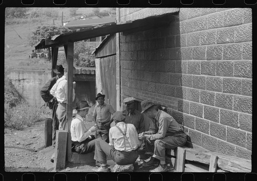 Card gambling in center of town, Osage, West Virginia