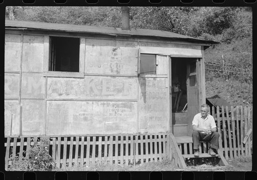 Unemployed miner's home he built. "It'll be purtier when I paint it." Scotts Run, Osage, West Virginia