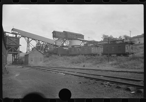 Untitled photo, possibly related to: Part of coal mine tipple with workers' homes in background. Pursglove Cleaning Plant No. 2, West Virginia