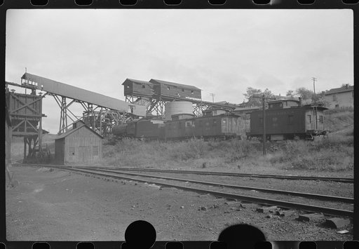 Untitled photo, possibly related to: Part of coal mine tipple with workers' homes in background. Pursglove Cleaning Plant No. 2, West Virginia