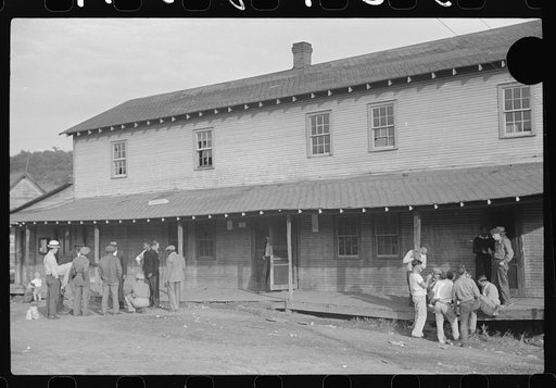 Untitled photo, possibly related to: Company store, Saturday afternoon. At left, miners shooting craps; at right, card gambling, favorite pastime. Chaplin, West Virginia