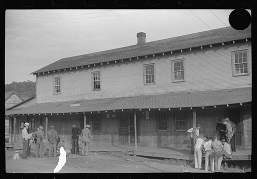 Untitled photo, possibly related to: Company store, Saturday afternoon. At left, miners shooting craps; at right, card gambling, favorite pastime. Chaplin, West Virginia