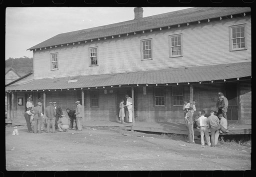 Company store, Saturday afternoon. At left, miners shooting craps; at right, card gambling, favorite pastime. Chaplin, West Virginia