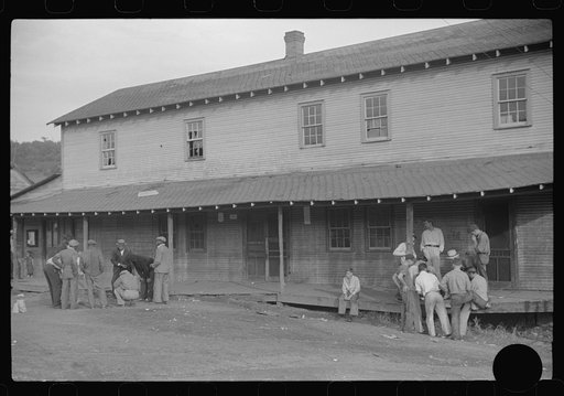 Untitled photo, possibly related to: Company store, Saturday afternoon. At left, miners shooting craps; at right, card gambling, favorite pastime. Chaplin, West Virginia
