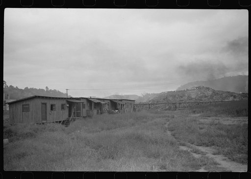 Section of Rosedale Mining Company. Shanties by the river (burning slag pile to right). These used to be United Mine Workers barracks just thrown up to temporarily house men thrown out of company houses, during strike. Scotts Run, West Virginia