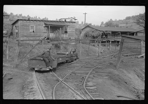 Coal miners switching motor. Note live wires. The "Patch," Chaplin, West Virginia