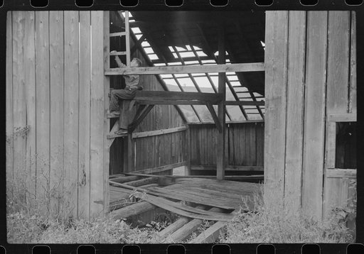 Playing in an old deserted barn on hill near mines, Chaplin, West Virginia