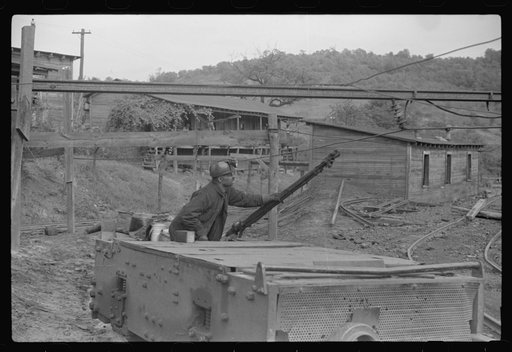 Coal miners switching motor. Note live wires. The "Patch," Chaplin, West Virginia