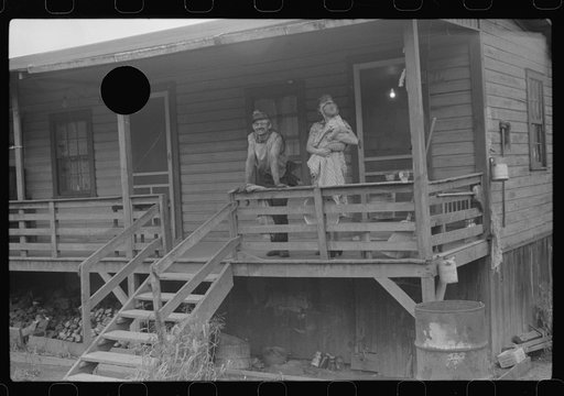 Untitled photo, possibly related to: Coal miner, his wife and baby living in one of shanties seen in nos. 30144-M2 and 30151-M1. Scotts Run, West Virginia