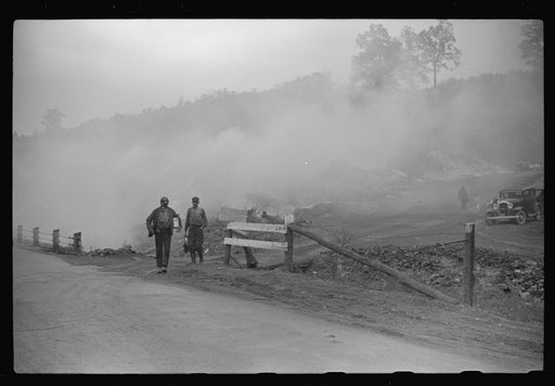 Coal miners coming from work. Slag heaps burning nearby. Maidsville, West Virginia