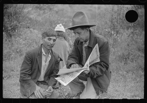 Untitled photo, possibly related to: Mexican miners looking at "funny papers." Bertha Hill, Scotts Run, West Virginia
