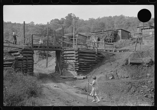 Untitled photo, possibly related to: Coal miner's children playing around tracks. Note live wires. Chaplin, West Virginia
