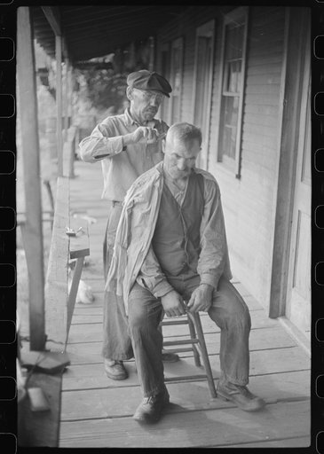 Miners often give haircuts on front porch. The "Patch," Chaplin, West Virginia