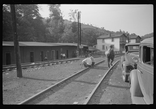 Along main highway, center of mining town, miner's shacks in left background, Osage, West Virginia