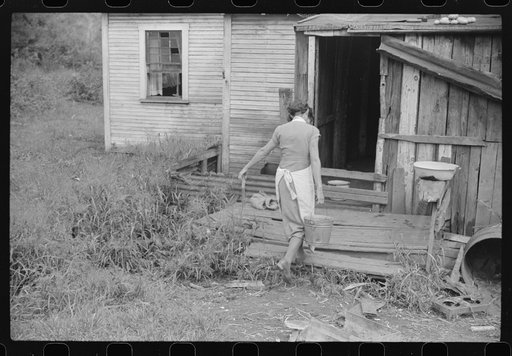 Coal miner's wife carrying water from up the hill, Bertha Hill, West Virginia