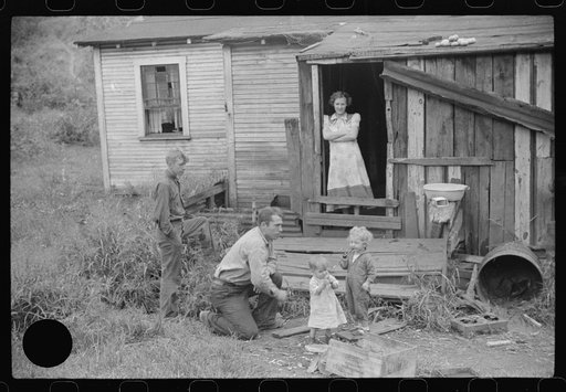 Untitled photo, possibly related to: Coal miner and some of his family in back of their home. Bertha Hill, West Virginia