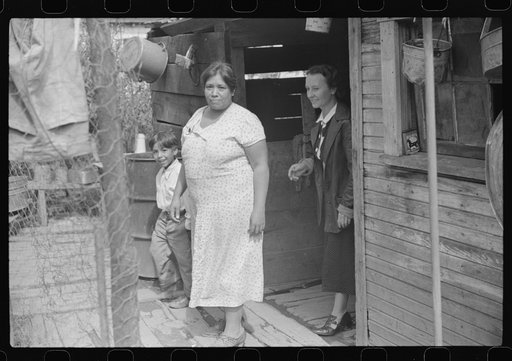 Mexican miner's wife and child are visited by another miner's wife (Hungarian) who is interested in starting a maternal health clinic there. Scotts Run, Bertha Hill, West Virginia
