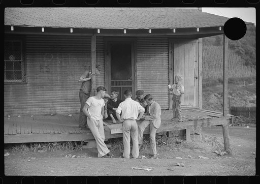 Untitled photo, possibly related to: Coal miners card gambling Saturday afternoon on porch of company store, Chaplin, West Virginia
