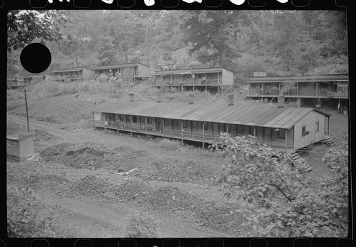Untitled photo, possibly related to: Coal miners' homes, company houses, with piles of slag and slate. "The Patch," Cassville, West Virginia