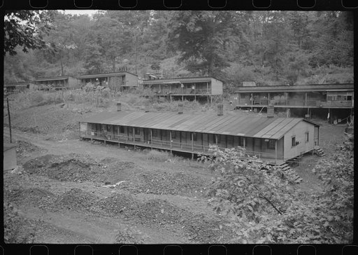 Untitled photo, possibly related to: Coal miners' homes, company houses, with piles of slag and slate. "The Patch," Cassville, West Virginia
