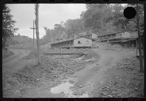Untitled photo, possibly related to: Coal miners' homes, company houses, with piles of slag and slate. "The Patch," Cassville, West Virginia