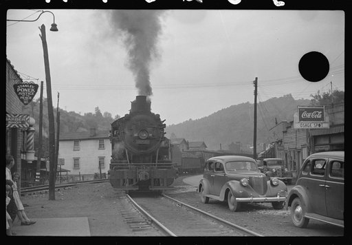 Untitled photo, possibly related to: Train pulling coal through center of town morning and evening, Osage, West Virginia