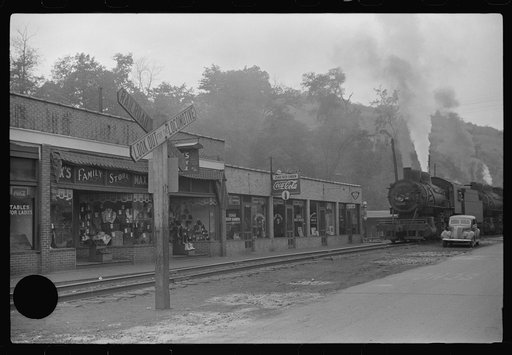 Untitled photo, possibly related to: Train pulling coal through center of town morning and evening, Osage, West Virginia