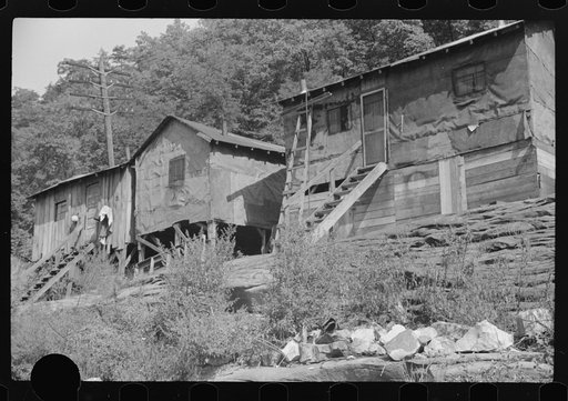 Untitled photo, possibly related to: Shacks inhabited by Negroes, along river on highway between Charleston and Gauley Bridge, West Virginia