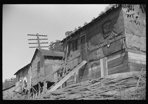 Shacks inhabited by Negroes, along river on highway between Charleston and Gauley Bridge, West Virginia