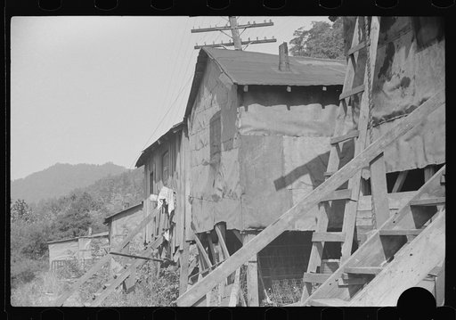 Untitled photo, possibly related to: Shacks inhabited by Negroes, along river on highway between Charleston and Gauley Bridge, West Virginia