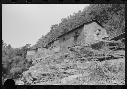 Untitled photo, possibly related to: Shacks inhabited by Negroes along river on highway between Charleston and Gauley Bridge, West Virginia