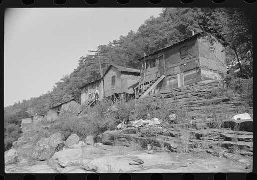 Untitled photo, possibly related to: Shacks inhabited by Negroes along river on highway between Charleston and Gauley Bridge, West Virginia