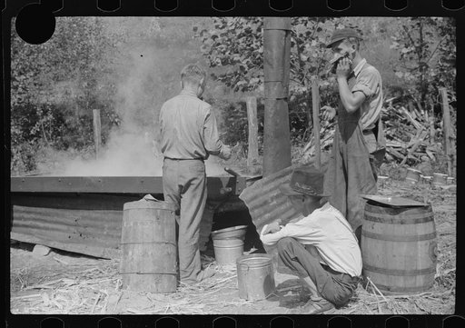 Untitled photo, possibly related to: Racine, West Virginia. Making molasses is hot work