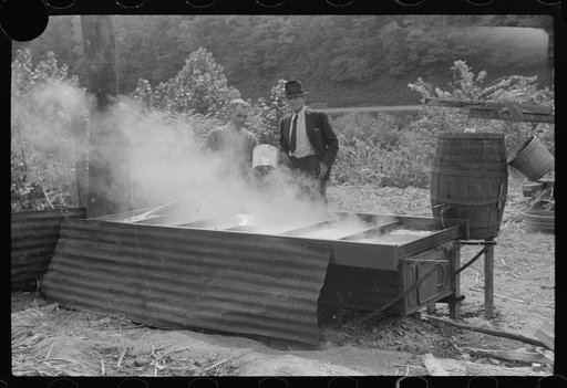 Untitled photo, possibly related to: Racine, West Virginia. Making molasses is hot work