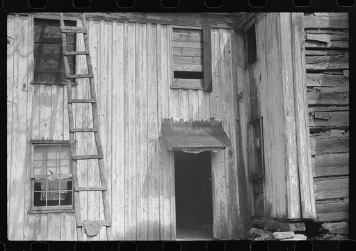 Old abandoned farmhouse on main highway between Morgantown and Elkins, West Virginia. Someone lives in one room