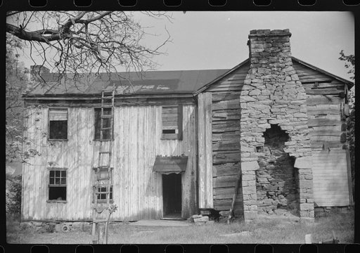 Old abandoned farmhouse on main highway between Morgantown and Elkins, West Virginia. Someone lived in one room