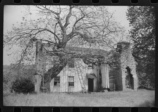 Old abandoned farmhouse on main highway between Morgantown and Elkins, West Virginia. Someone lived in one room